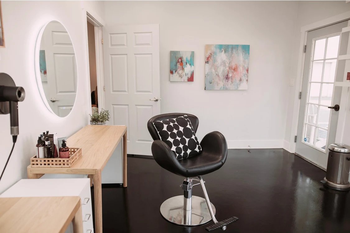 Modern styling station with LED mirror and organic hair products at DaneStyles Hair Artistry salon in Snohomish, WA
