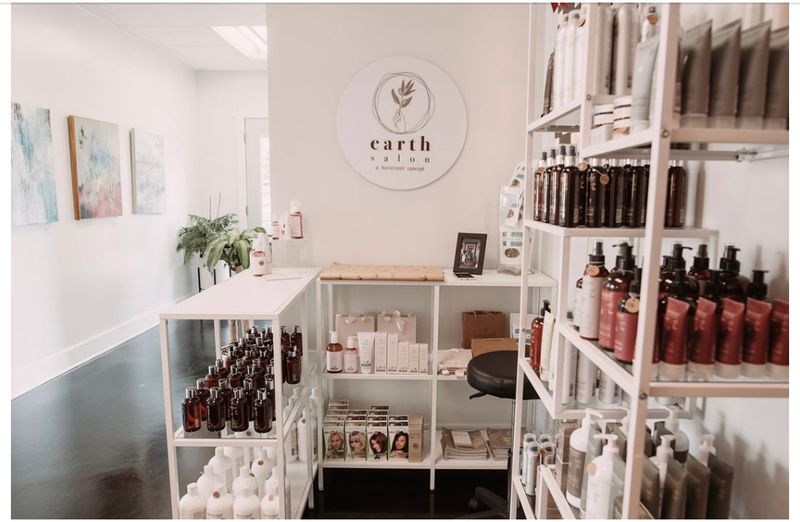 Earth Salon retail display featuring Natulique organic hair products at DaneStyles Hair Artistry