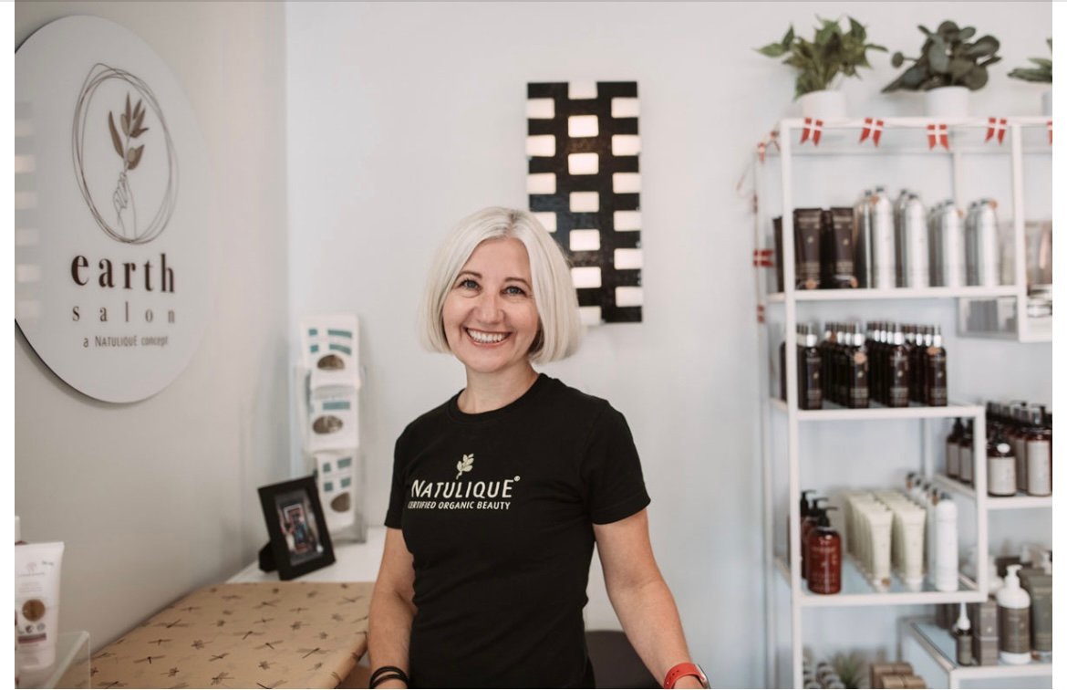 Lone Holt, owner of DaneStyles Hair Artistry, at Earth Salon with Natulique certified organic hair products in Snohomish, WA